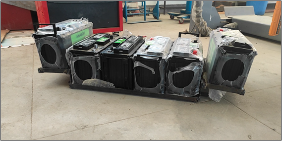 Photograph of the custom fabricated battery boxes installed in the vehicle chassis